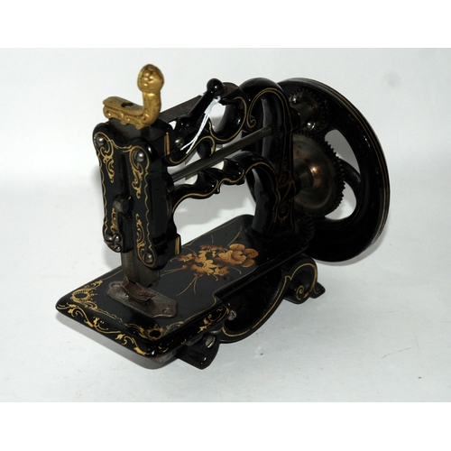 375 - A Victorian miniature sewing machine by Charles Raymond