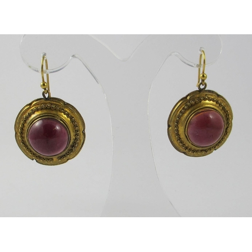 42 - A pair of garnet set Earrings.