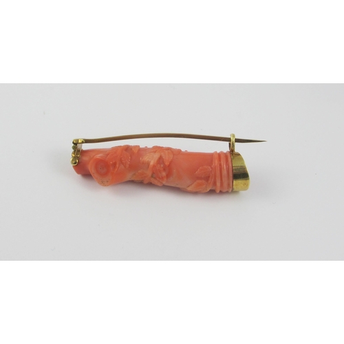 66 - A carved coral brooch