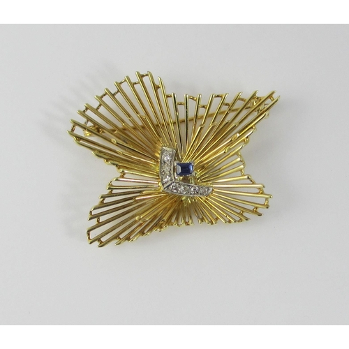 71 - A retro designed starburst brooch