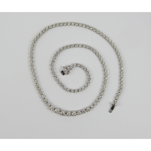 80 - An 18ct diamond set line necklet.