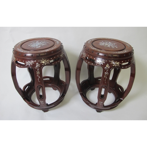 835 - A pair of Chinese rosewood veneered and mother of pearl decorated barrel shaped stools