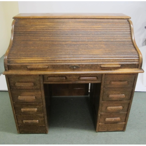 837 - An oak roll top desk