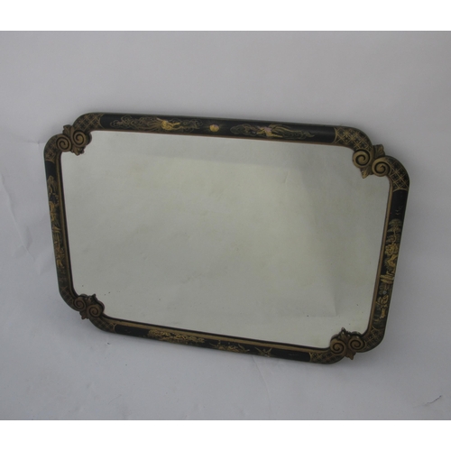 840 - A 20th Century black and gilt japanned wall mirror