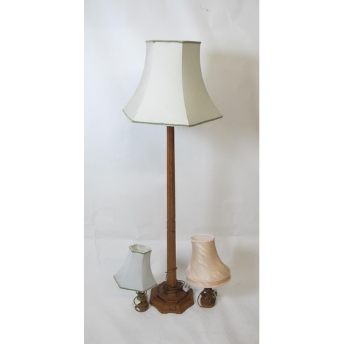 852 - An oak floor lamp with shade