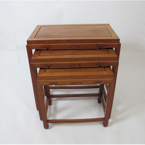 857 - A Chinese hardwood nest of three tables