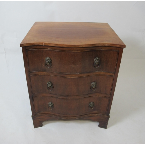 859 - A mahogany serpentine chest of drawers in the George III style