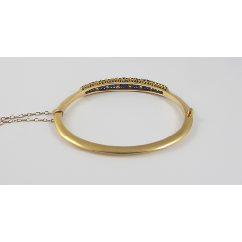 86 - An Edwardian sapphire and diamond bangle