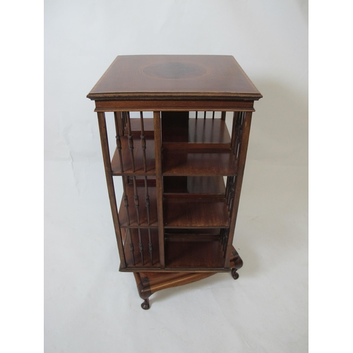 862 - An Edwardian mahogany inlaid revolving bookcase