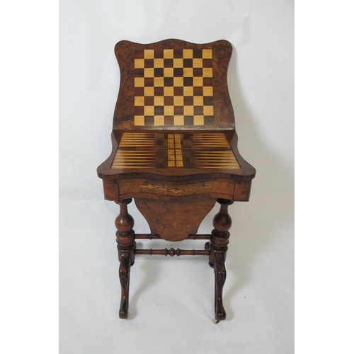 863 - A Victorian walnut inlaid games/sewing table