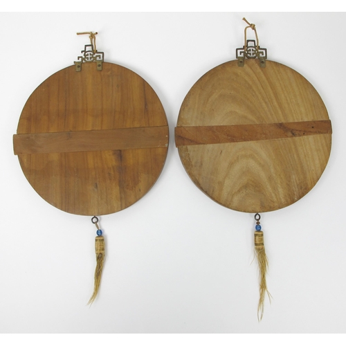 509 - A pair of Chinese circular wood plaques