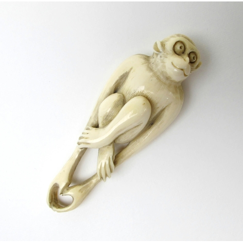 524 - A Japanese ivory netsuke of a Monkey