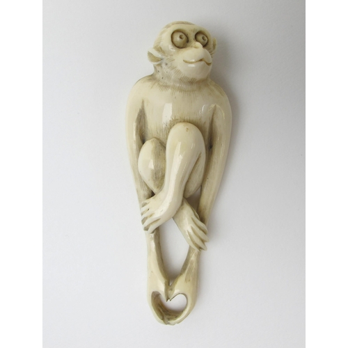 524 - A Japanese ivory netsuke of a Monkey