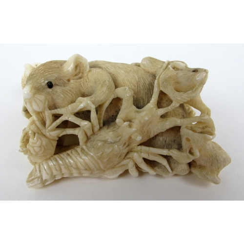 543 - A Japanese carved ivory group of rats  fish  seashells and a lobster