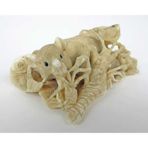 543 - A Japanese carved ivory group of rats  fish  seashells and a lobster