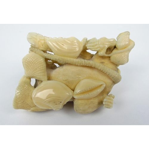 543 - A Japanese carved ivory group of rats  fish  seashells and a lobster