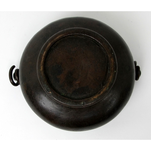 546 - A Tibetan bronze circular hand mirror