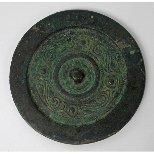 546 - A Tibetan bronze circular hand mirror