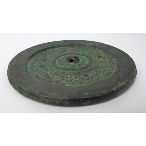 546 - A Tibetan bronze circular hand mirror