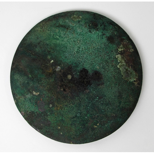 546 - A Tibetan bronze circular hand mirror