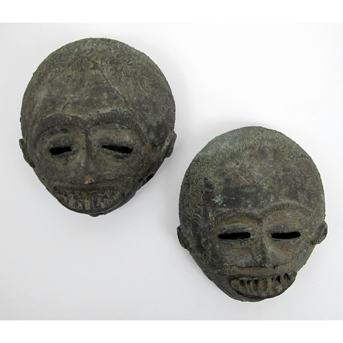 550 - Two African bronze grotesque masks