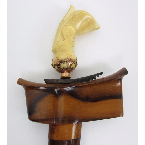 557 - A Malaysian Kris with ivory carved handle