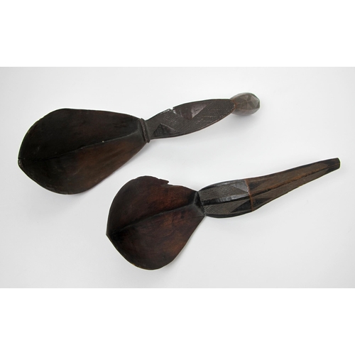 560 - Three North American Indian carved spoons