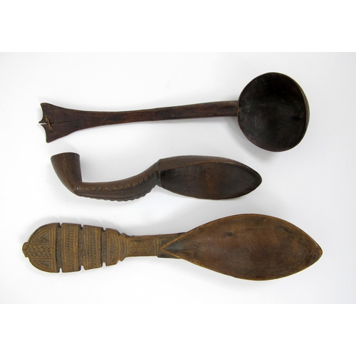 560 - Three North American Indian carved spoons