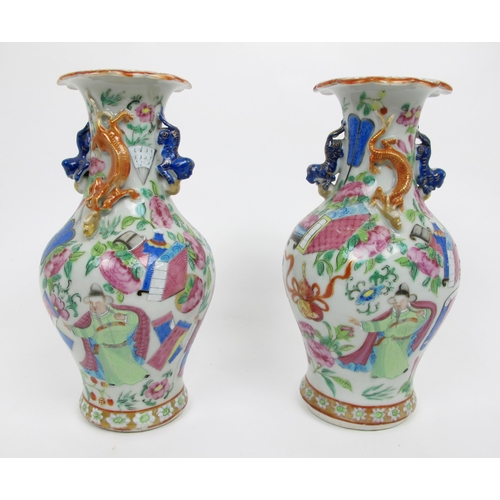 564 - A pair of Cantonese famille rose baluster vases