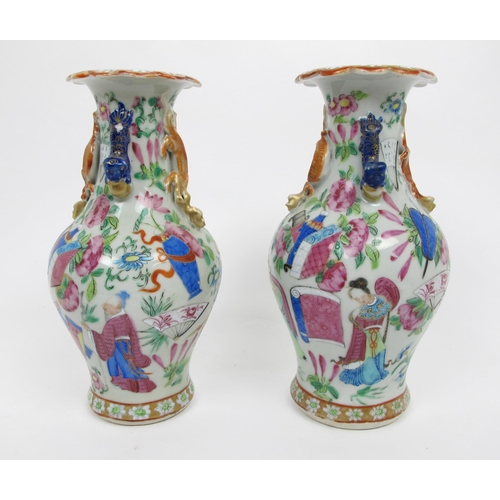 564 - A pair of Cantonese famille rose baluster vases