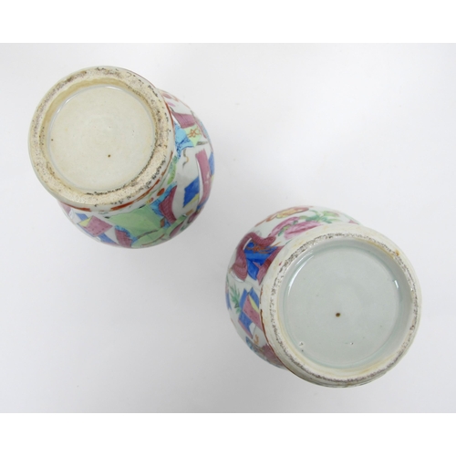 564 - A pair of Cantonese famille rose baluster vases