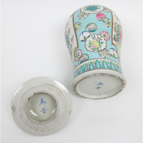 565 - A pair of Cantonese famille rose baluster jars and covers