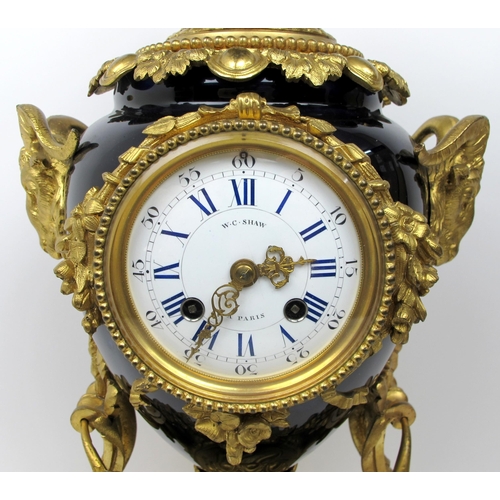 632 - A Louis XVI style gilt metal and porcelain mantle clock