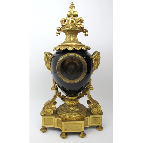 632 - A Louis XVI style gilt metal and porcelain mantle clock