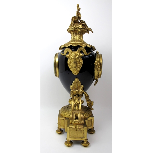 632 - A Louis XVI style gilt metal and porcelain mantle clock