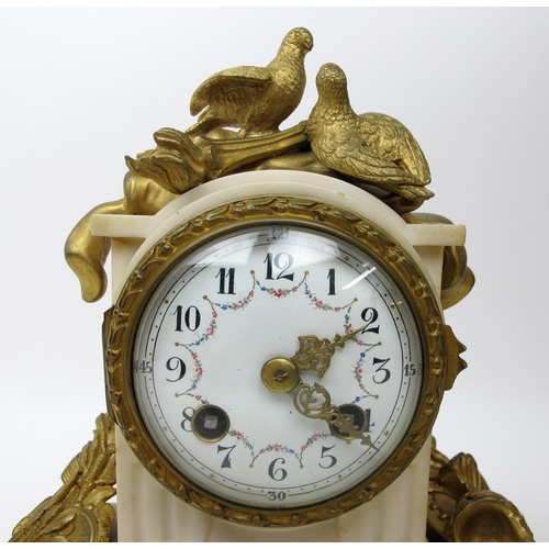 633 - A French gilt metal and white marble three piece clock garniture