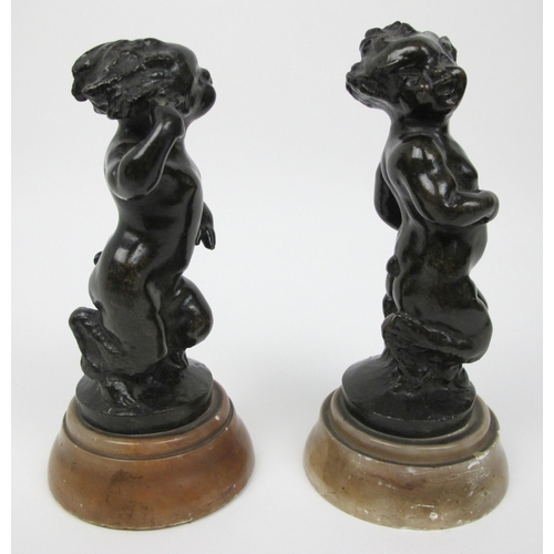 635 - A pair of bronze fauns