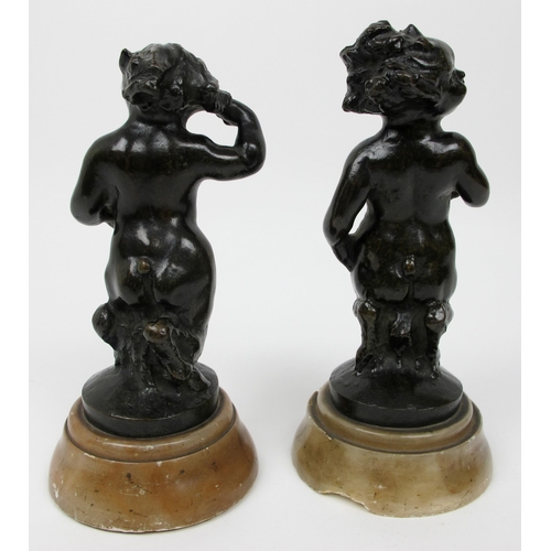 635 - A pair of bronze fauns