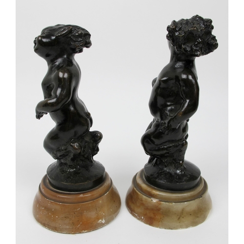 635 - A pair of bronze fauns