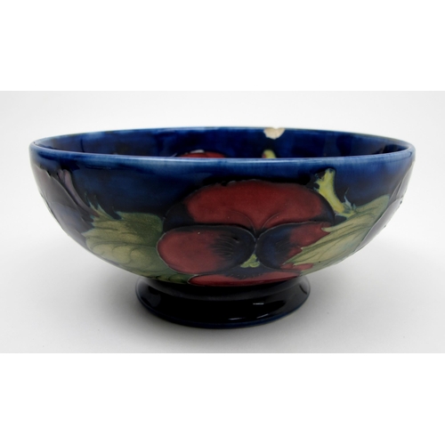 661 - A Moorcroft pottery Pansy vase c.1920