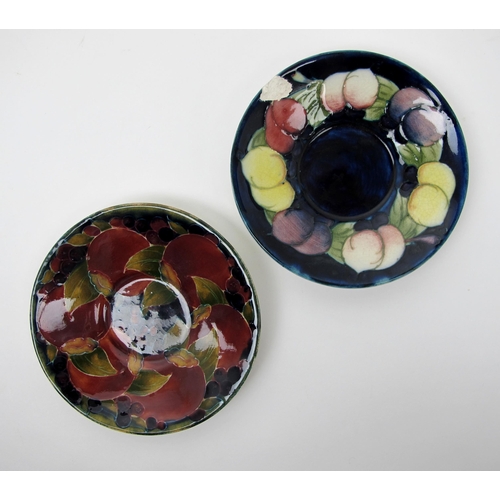 668 - A group of Moorcroft pottery saucers