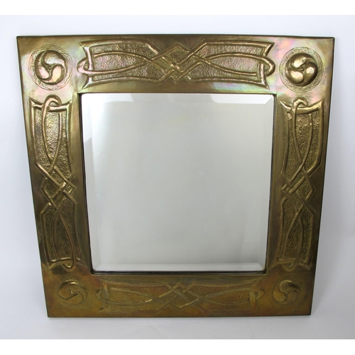 677 - An Arts and Crafts Scottish Celtic style brass mirror