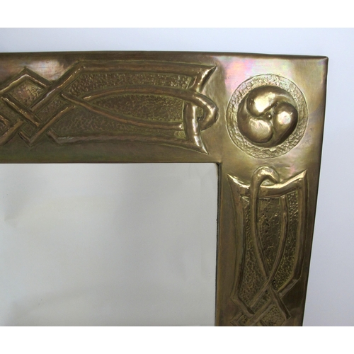 677 - An Arts and Crafts Scottish Celtic style brass mirror