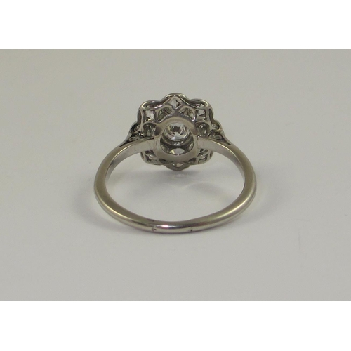 71 - A platinum diamond flower ring