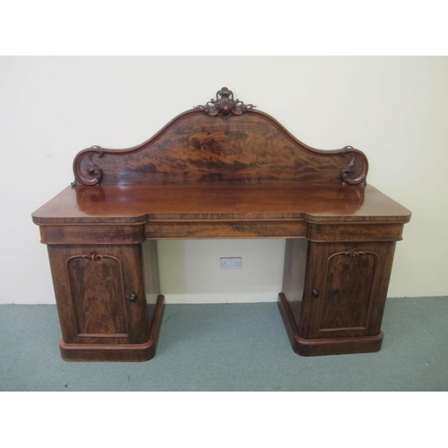 746 - A Victorian flame mahogany pedestal sideboard