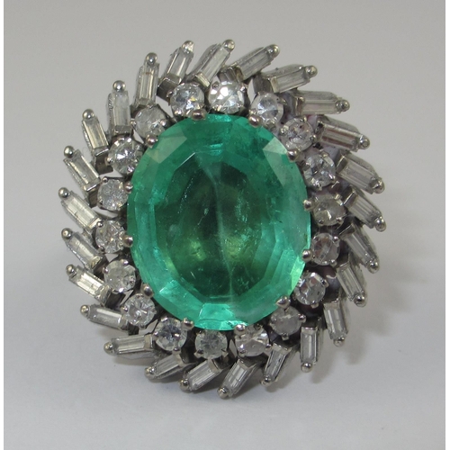 75 - A substantial emerald and diamond ring