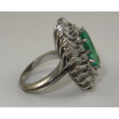 75 - A substantial emerald and diamond ring