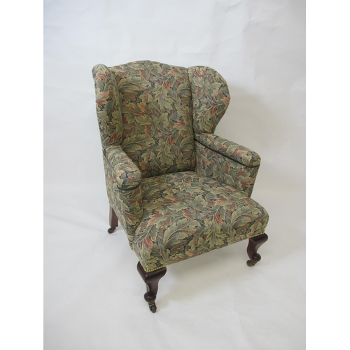 750 - A mahogany framed wing back armchair in the Georgian manner