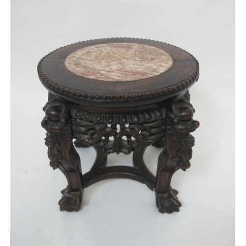 766 - A Chinese carved hardwood occasional table