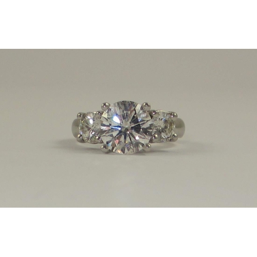 78 - A platinum three stone diamond ring